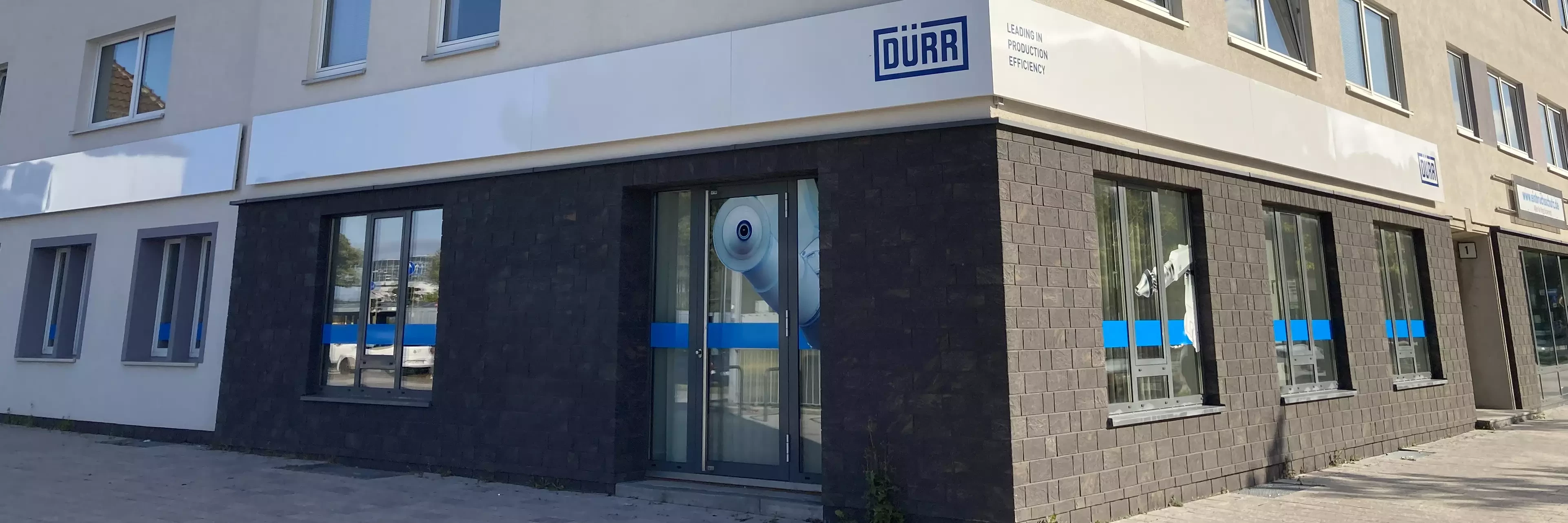  Dürr company building in Wolfsburg with the Dürr logo on the facade.